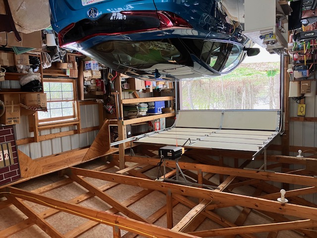 2066 Tolbert Road Hamilton, OH 45011 - Photo 38 of 63 This garage offers ample space for vehicles and storage, featuring an operational garage door and bright windows.
