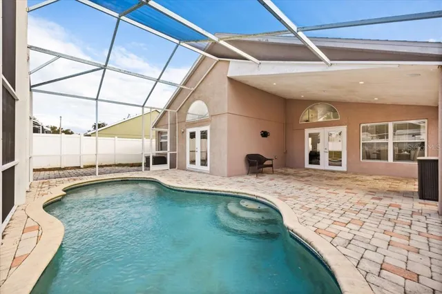 a bedroom with a bed and a chair