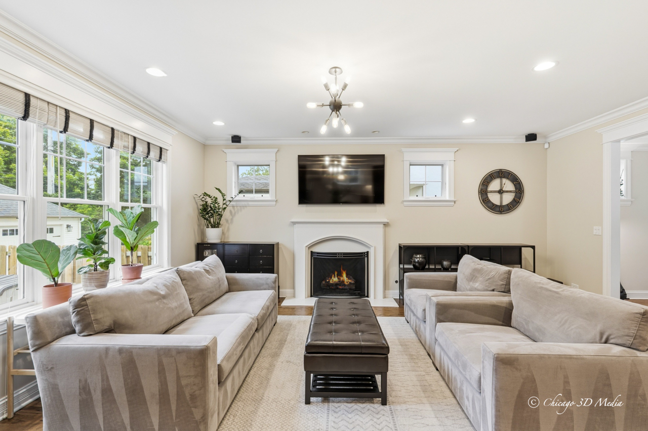 306 17th Street Wilmette, IL 60091 - Photo 9 of 48 a living room with furniture a fireplace and a flat screen tv