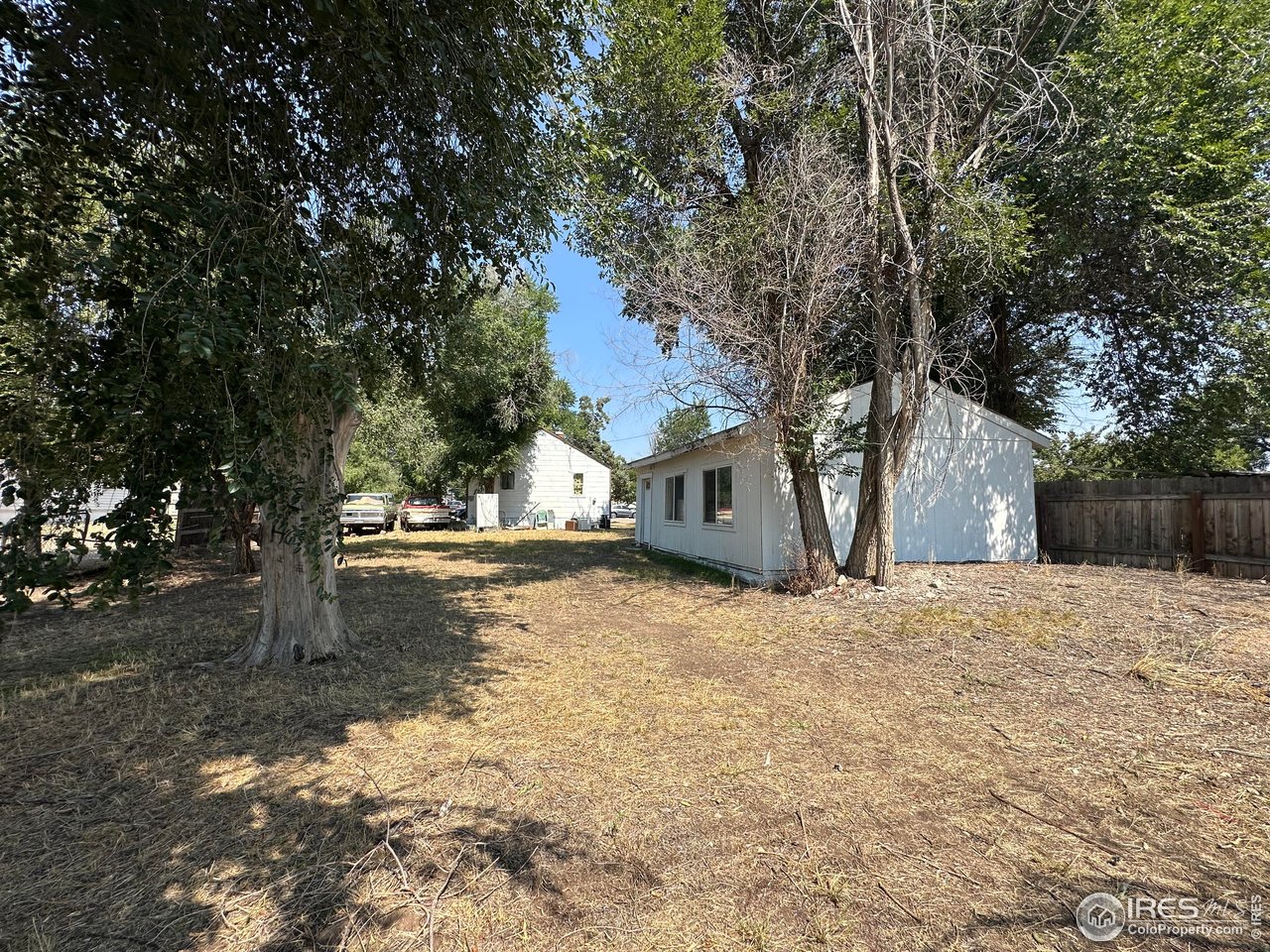 940 B Street Greeley, CO 80631 - Photo 2 of 2 a street view with large trees
