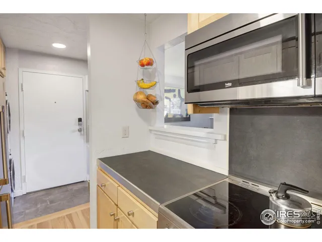 a kitchen with a sink and a microwave