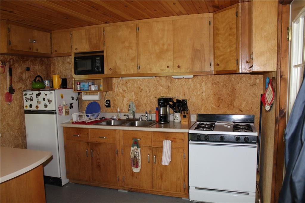 585 Old Spencer Road West Forks, ME 04985 - Photo 5 of 33 Large kitchen with plenty of storage.