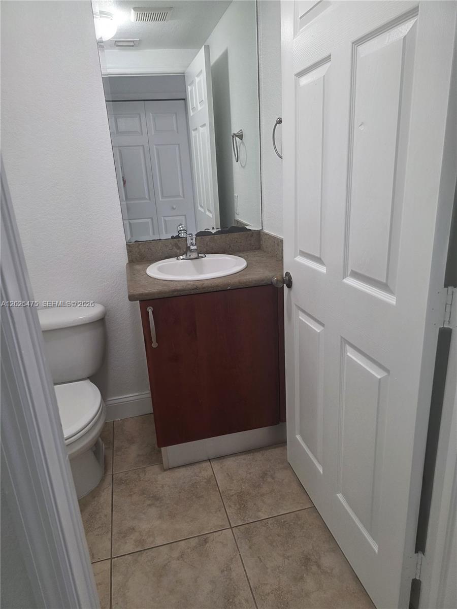 7477 Northwest 181st Street Hialeah, FL 33015 - Photo 3 of 12 half bathroom downstairs