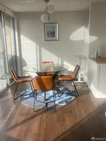 a work room with furniture and a rug