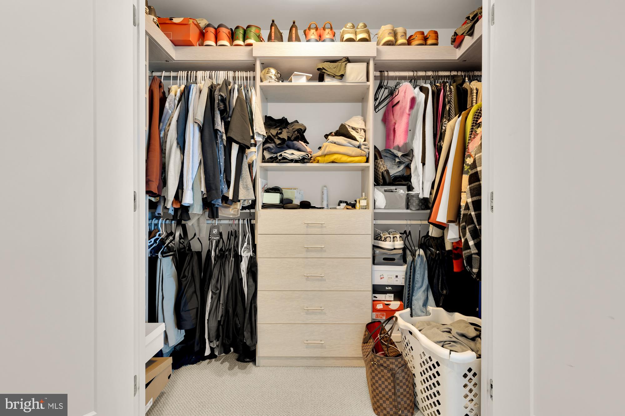 45 Sutton Square Southwest, Unit 706 Washington, DC 20024 - Photo 20 of 51 a view of walk in closet with clothes