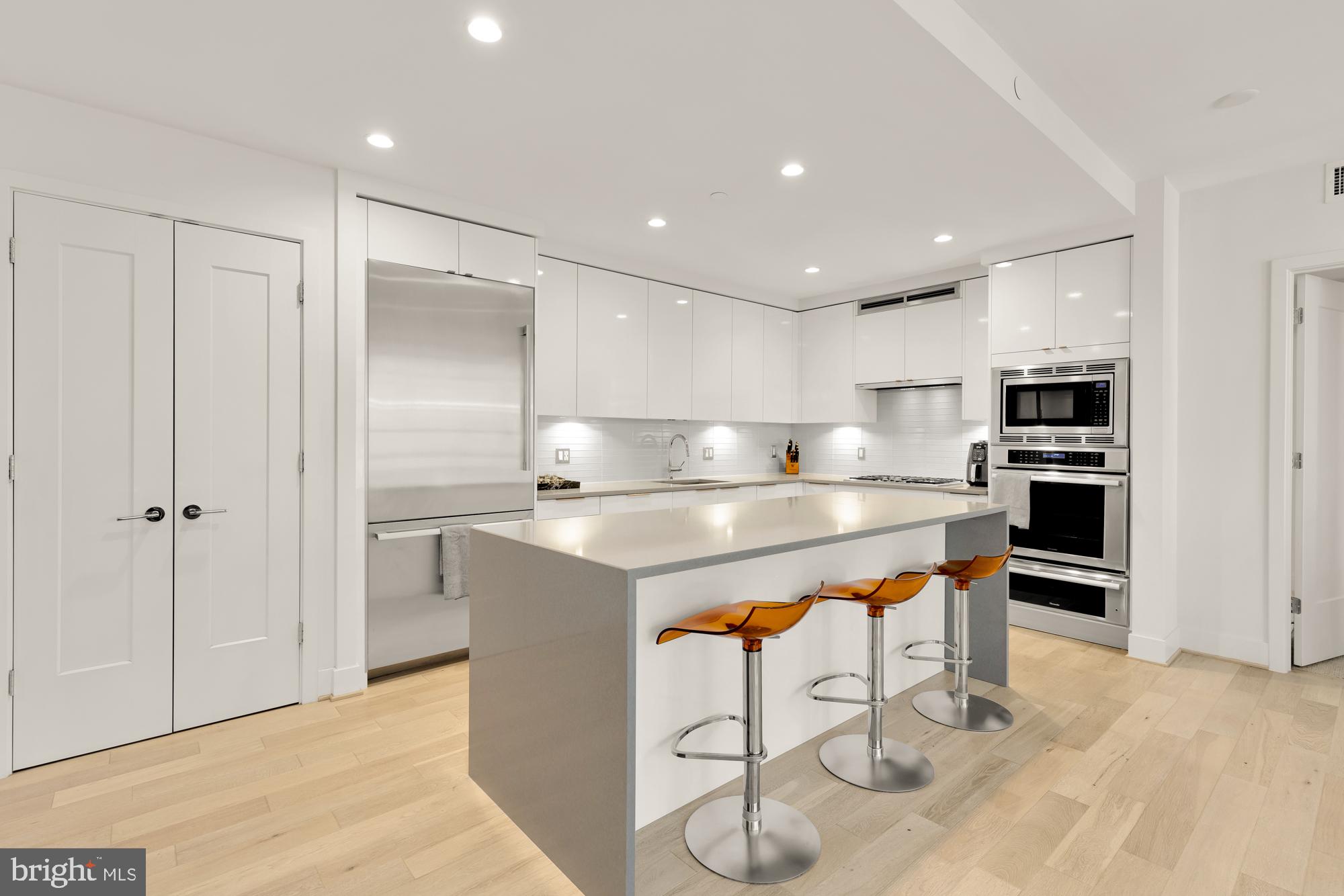 45 Sutton Square Southwest, Unit 706 Washington, DC 20024 - Photo 8 of 51 a kitchen with stainless steel appliances granite countertop a refrigerator and a sink