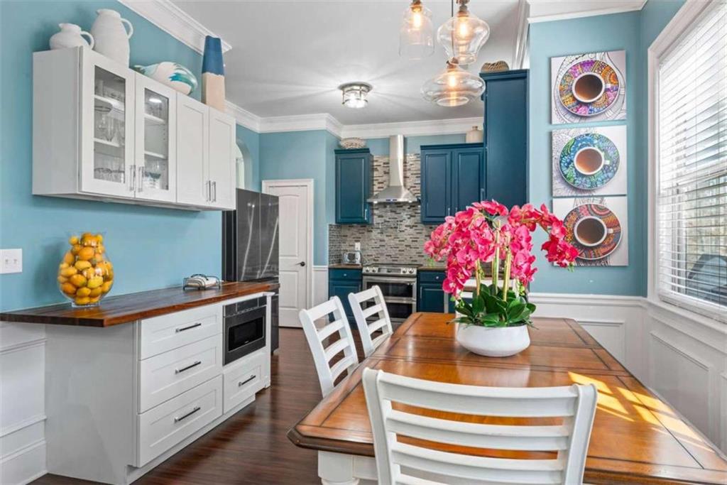 132 Luke Cove Hampton, GA 30228 - Photo 23 of 36 a view of a dining room with furniture and a potted plant