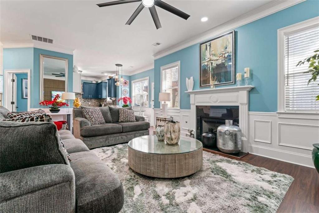 132 Luke Cove Hampton, GA 30228 - Photo 29 of 36 a living room with furniture and a fireplace