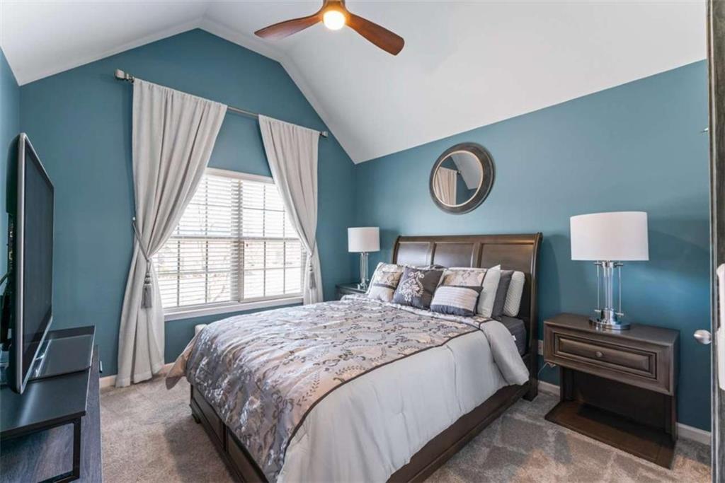 132 Luke Cove Hampton, GA 30228 - Photo 31 of 36 a bedroom with a bed and a window