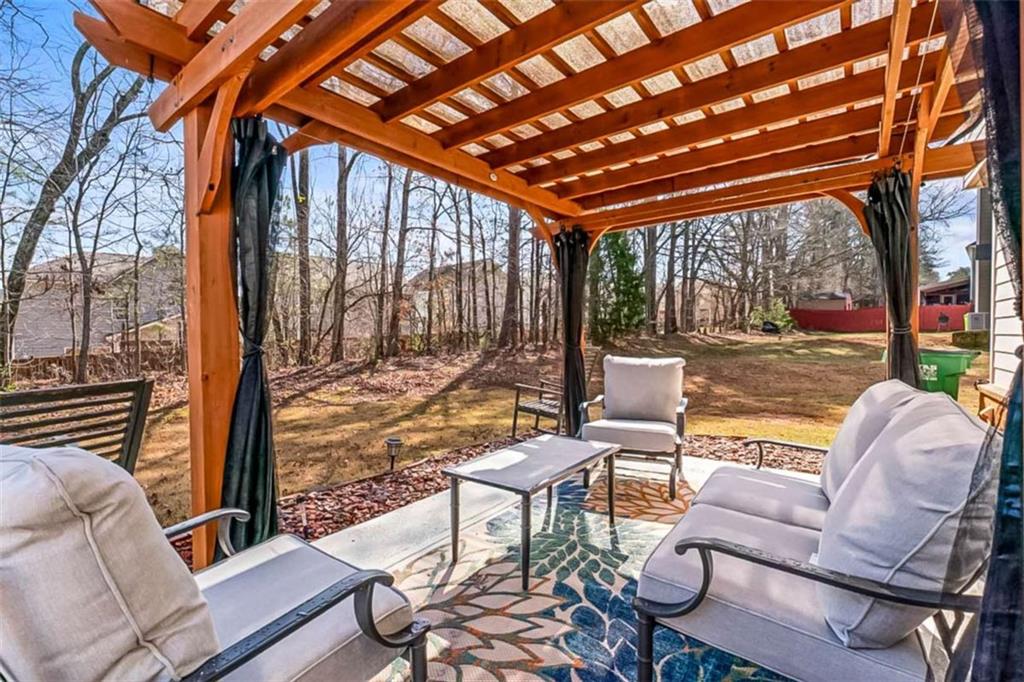 132 Luke Cove Hampton, GA 30228 - Photo 32 of 36 a building outdoor space with patio furniture