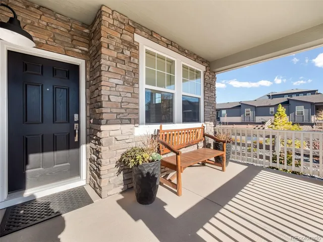 a view of a patio with couches and potted plants