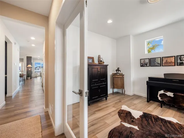 a bedroom with a bed and a view of kitchen