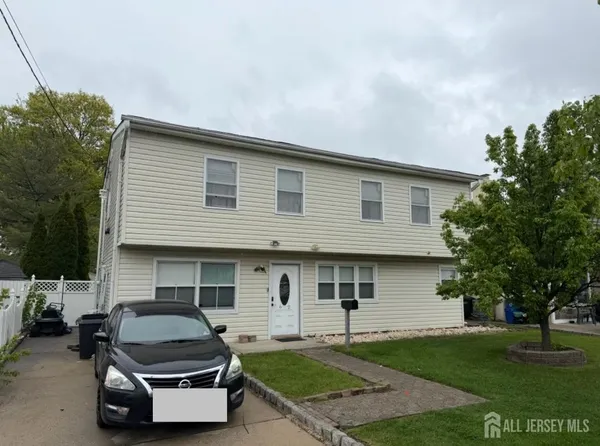 a car parked in front of a house