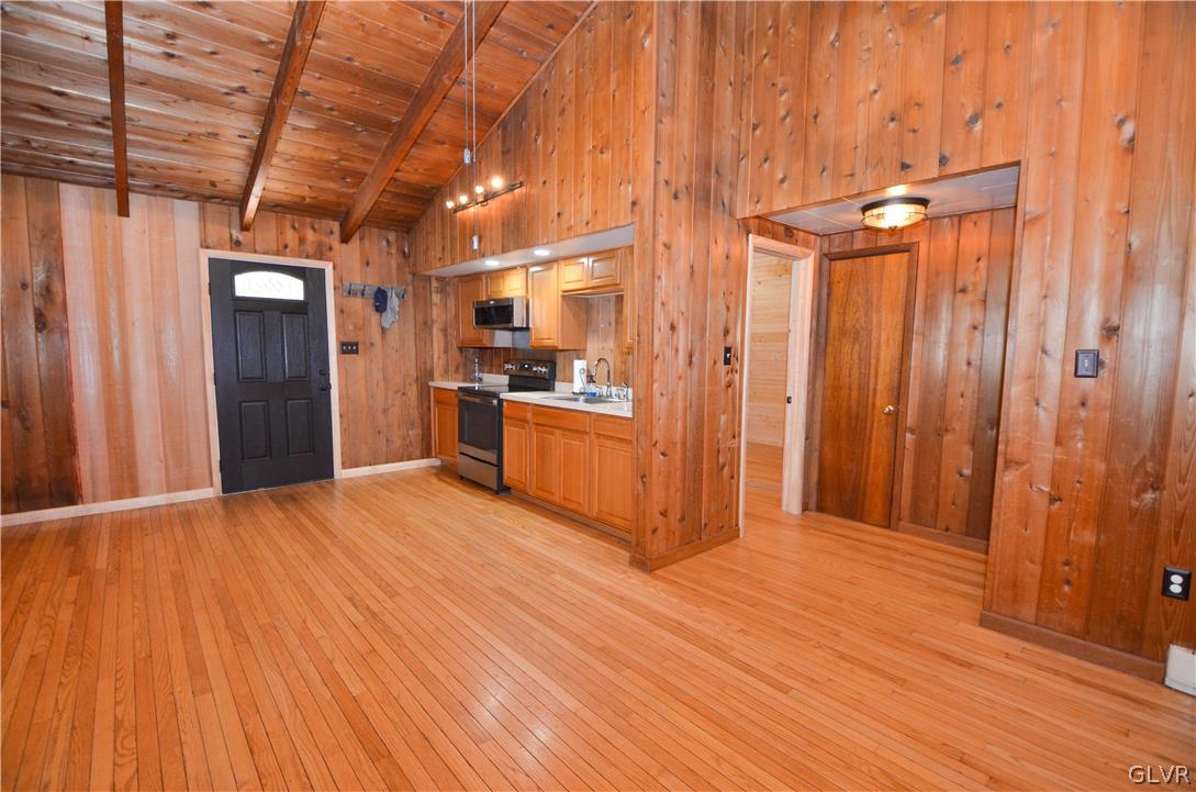 135 Rustic Road Kunkletown, PA 18058 - Photo 4 of 11 a view of empty room with wooden floor and appliances