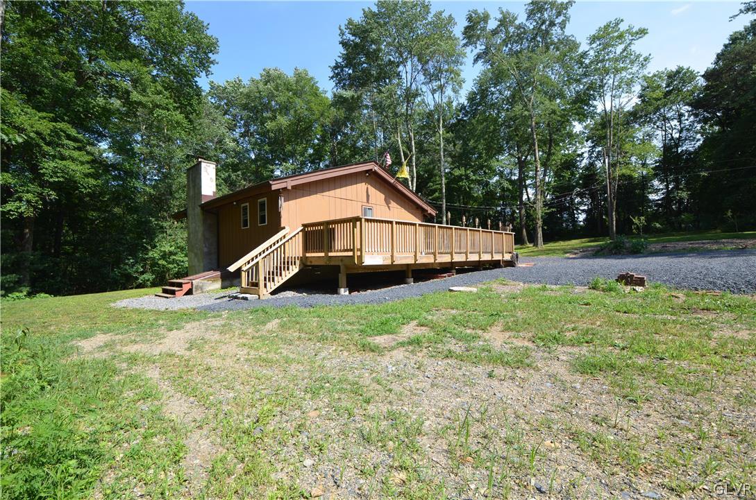 135 Rustic Road Kunkletown, PA 18058 - Photo 9 of 11 a view of a house with a yard and sitting area