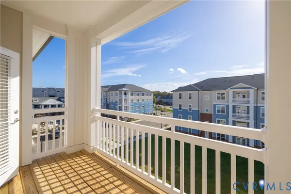 a view of a terrace with a bench in the background