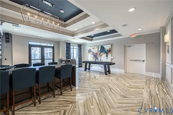 a view of a kitchen with dining room and wooden floor