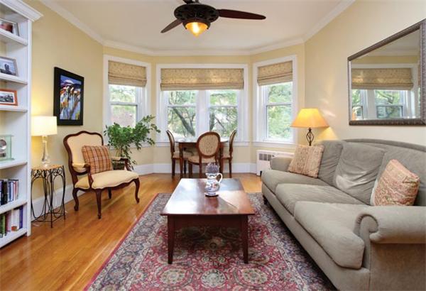 21 Warwick Road, Unit 3 Brookline, MA 02445 - Photo 1 of 5 a living room with furniture chandelier and a large window