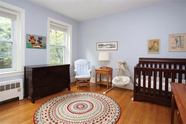 21 Warwick Road, Unit 3 Brookline, MA 02445 - Photo 4 of 5 a living room with furniture and a rug
