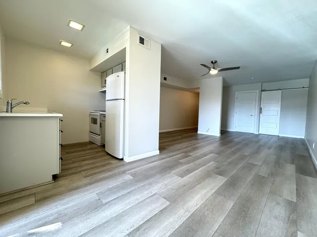 an empty room with a storage & utility room