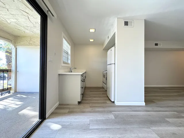 wooden floor in an empty room and a window