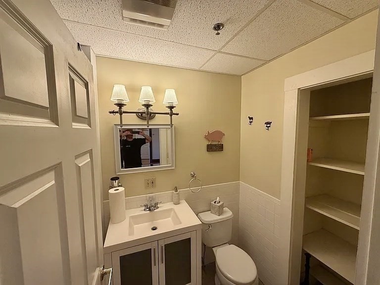 27 High Street, Unit 1 Clinton, MA 01510 - Photo 20 of 30 a bathroom with a toilet sink and mirror