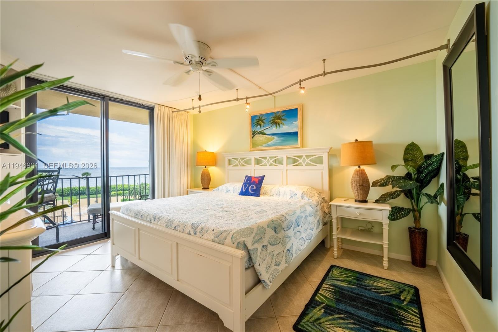 100 Ocean Trail Way, Unit 408 Jupiter, FL 33477 - Photo 1 of 46 a bed room with a bed and a chandelier