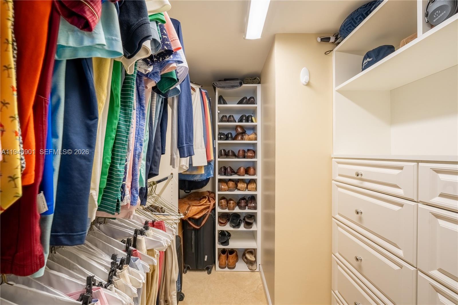 100 Ocean Trail Way, Unit 408 Jupiter, FL 33477 - Photo 11 of 46 a view of walk in closet with clothes and shoes
