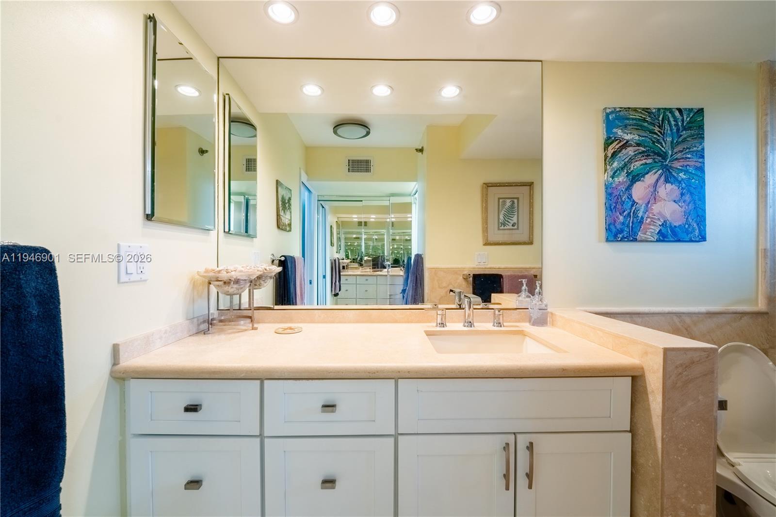 100 Ocean Trail Way, Unit 408 Jupiter, FL 33477 - Photo 12 of 46 a bathroom with a sink double vanity and a mirror