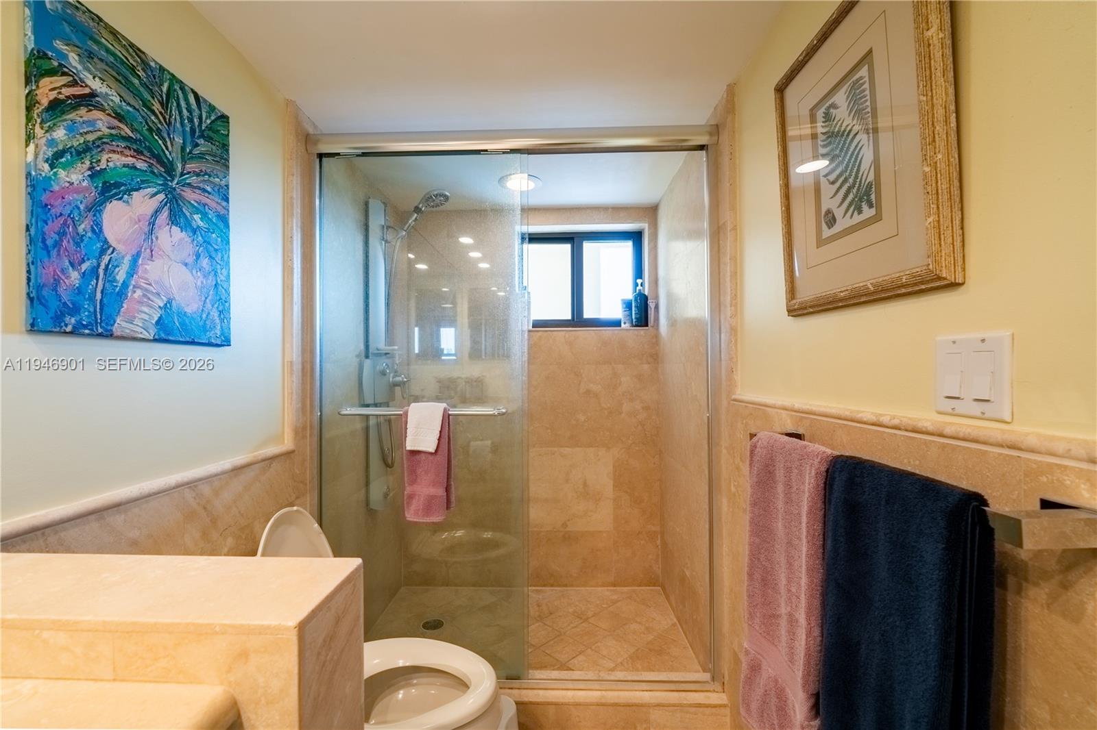 100 Ocean Trail Way, Unit 408 Jupiter, FL 33477 - Photo 15 of 46 a bathroom with a bathtub and a shower