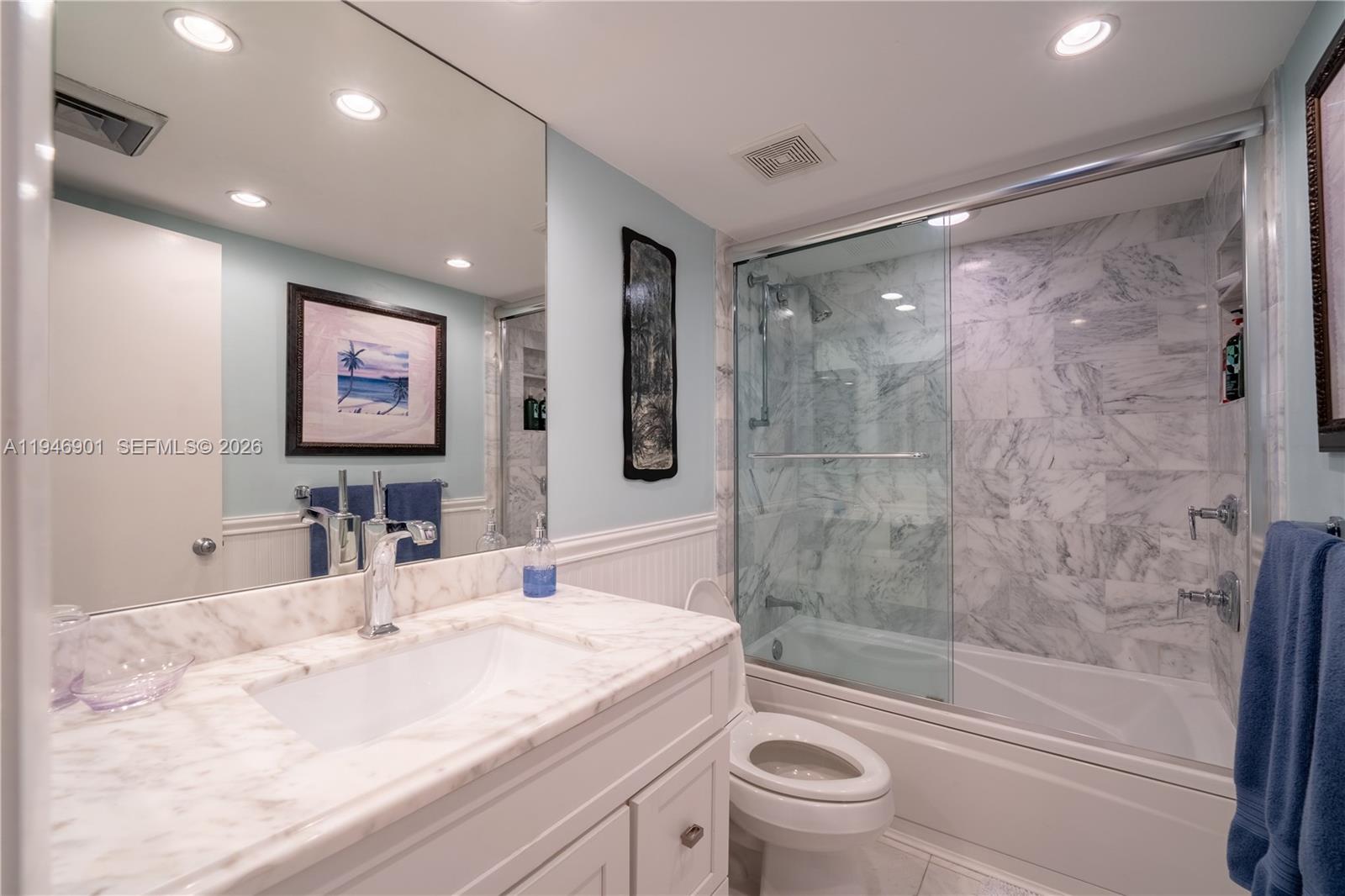 100 Ocean Trail Way, Unit 408 Jupiter, FL 33477 - Photo 17 of 46 a bathroom with a granite countertop sink toilet and shower