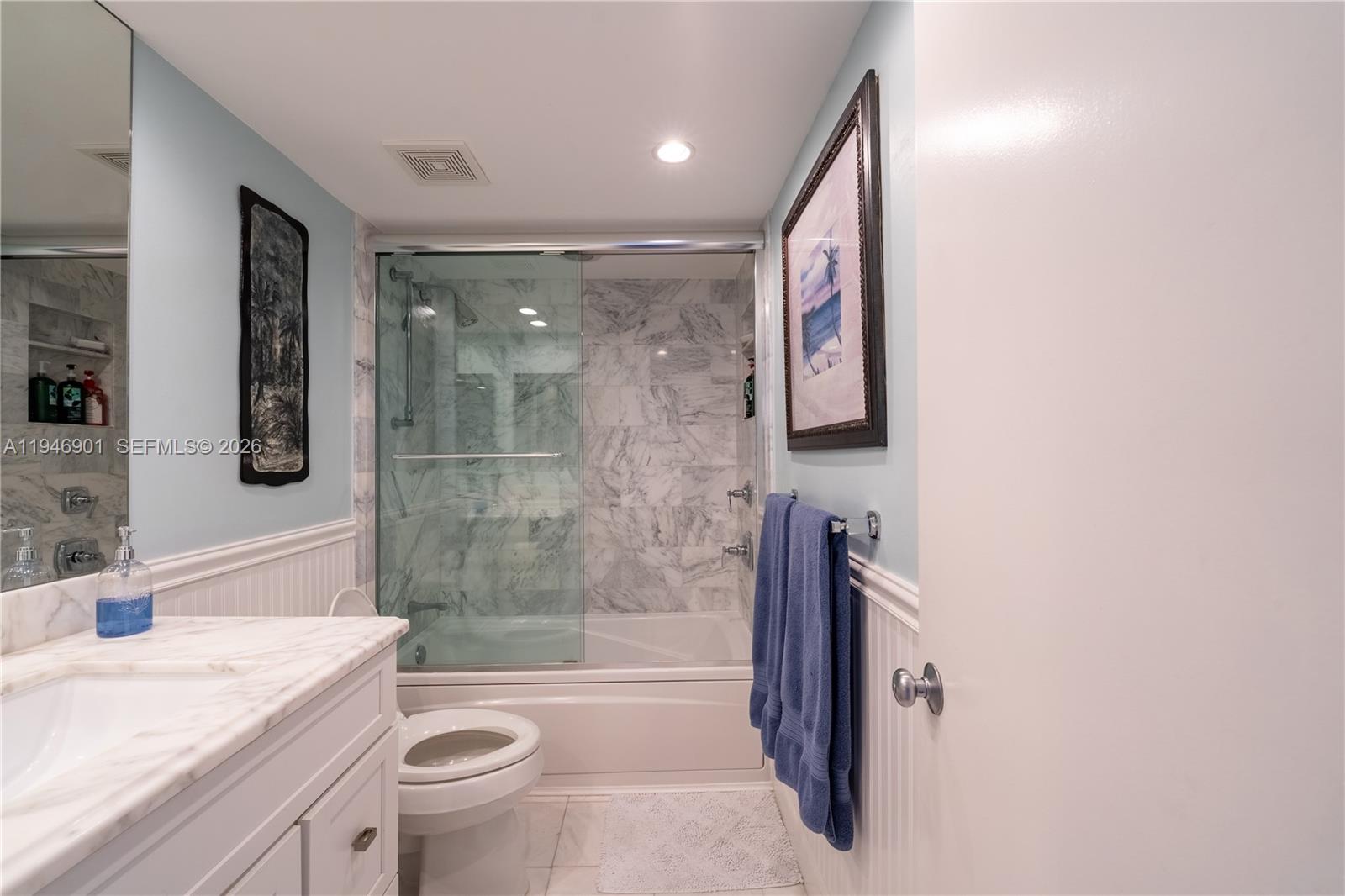 100 Ocean Trail Way, Unit 408 Jupiter, FL 33477 - Photo 19 of 46 a bathroom with a granite countertop sink toilet and shower