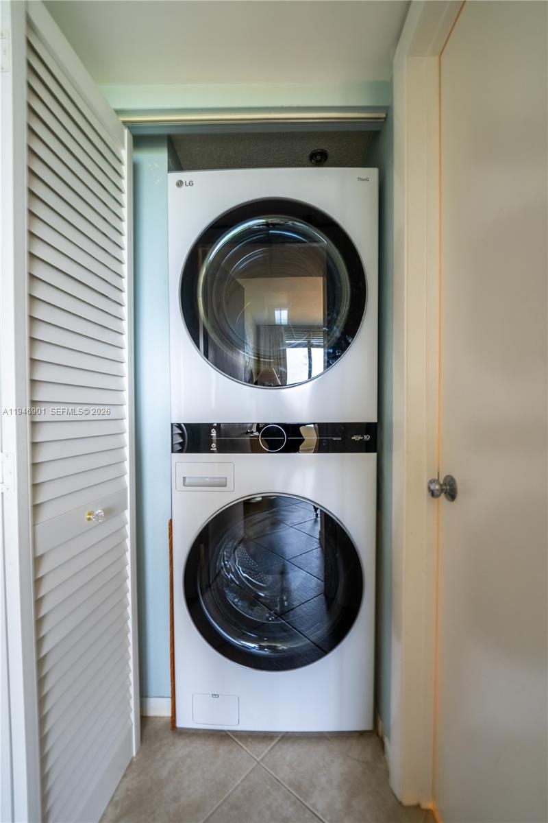 100 Ocean Trail Way, Unit 408 Jupiter, FL 33477 - Photo 20 of 46 a close up view of a washer and dryer