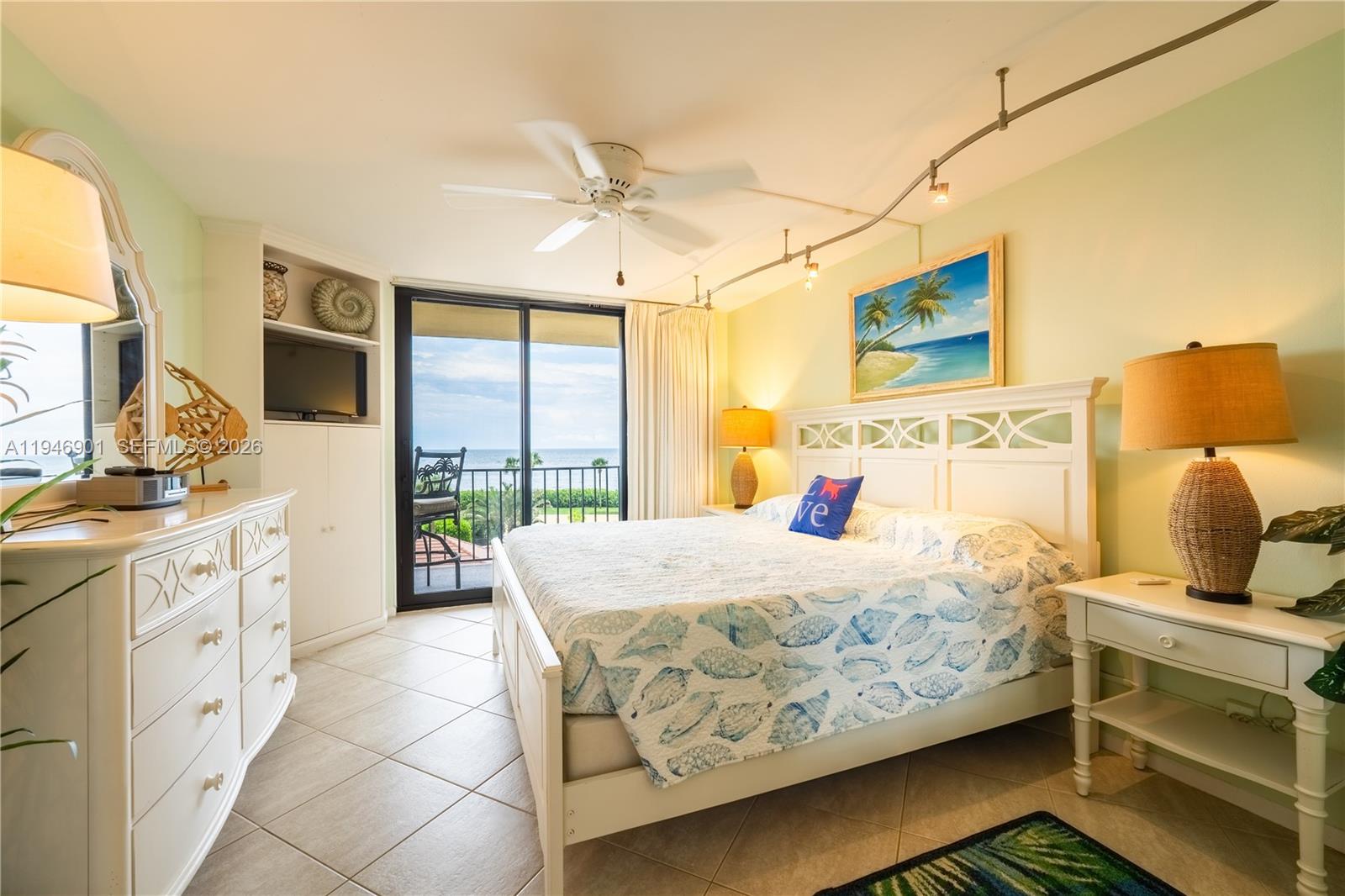 100 Ocean Trail Way, Unit 408 Jupiter, FL 33477 - Photo 2 of 46 a bedroom with a bed and large windows
