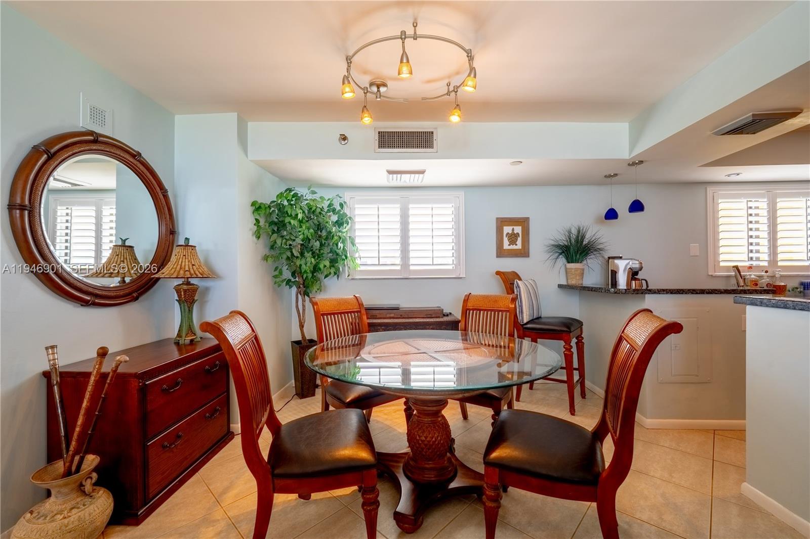 100 Ocean Trail Way, Unit 408 Jupiter, FL 33477 - Photo 31 of 46 a dining room with furniture and window