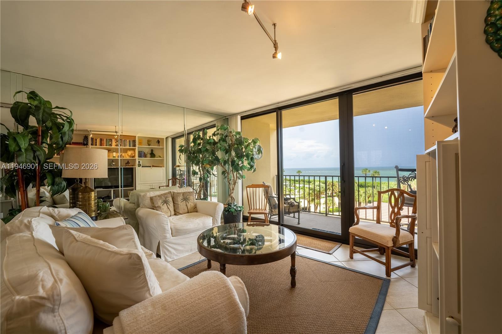 100 Ocean Trail Way, Unit 408 Jupiter, FL 33477 - Photo 33 of 46 a living room with furniture and a large window