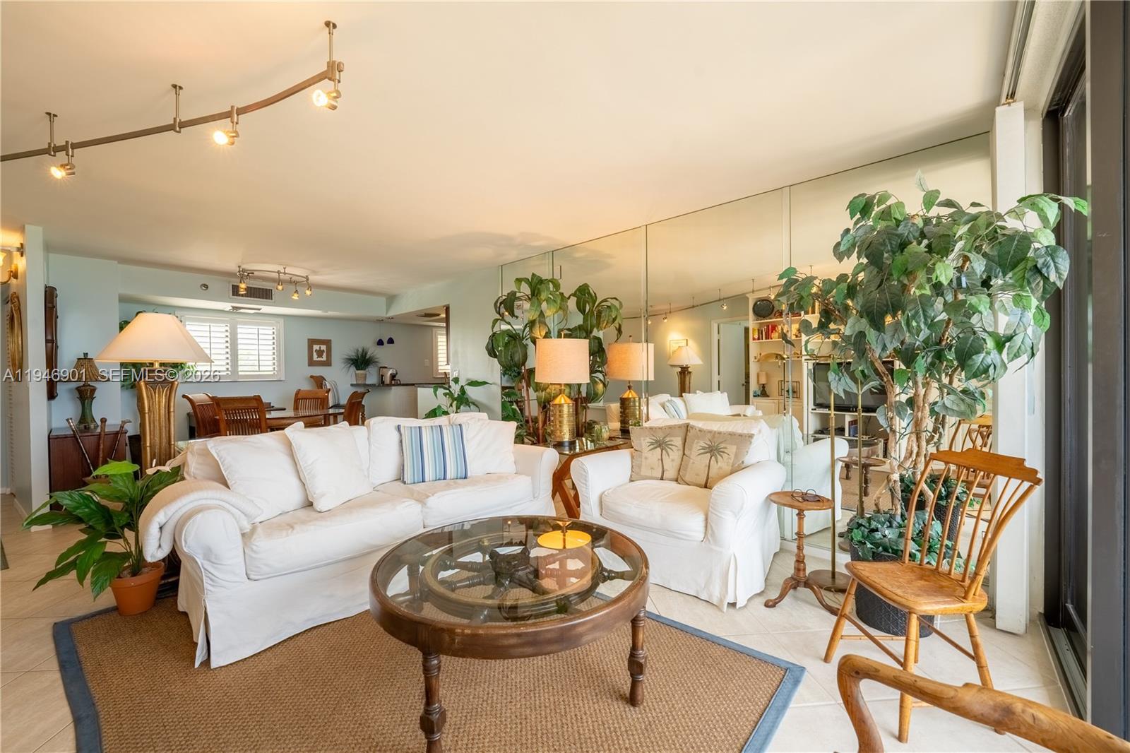 100 Ocean Trail Way, Unit 408 Jupiter, FL 33477 - Photo 36 of 46 a living room with furniture and a potted plant