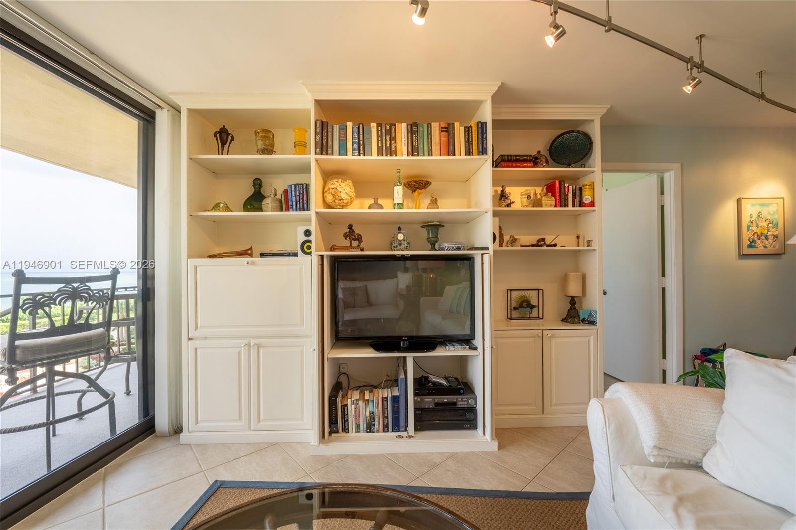 100 Ocean Trail Way, Unit 408 Jupiter, FL 33477 - Photo 39 of 46 a living room with furniture a rug and a window