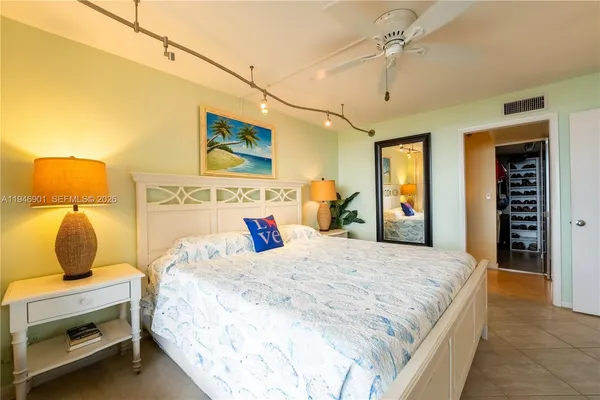 a bedroom with a bed and cabinets