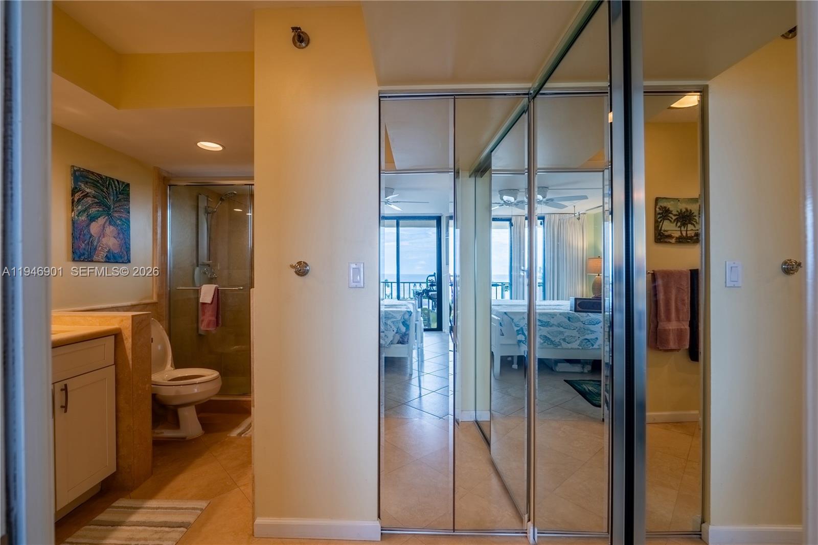 100 Ocean Trail Way, Unit 408 Jupiter, FL 33477 - Photo 6 of 46 a bathroom with a glass door shower and a toilet