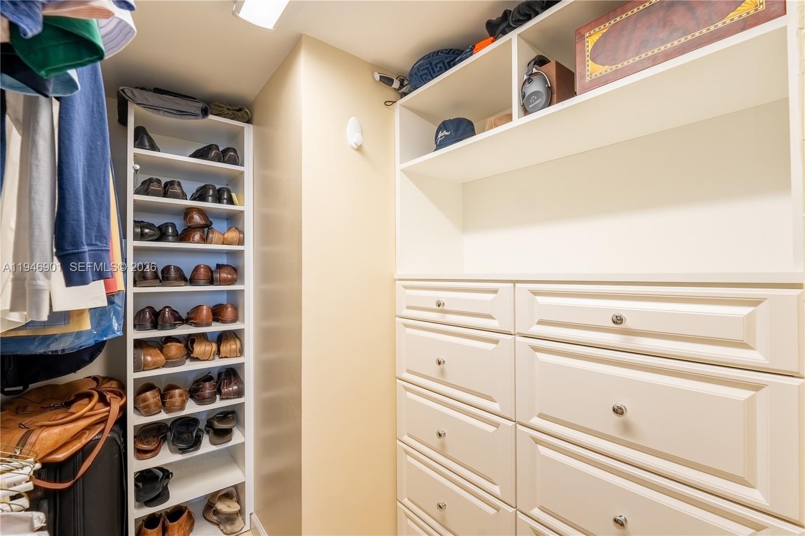 100 Ocean Trail Way, Unit 408 Jupiter, FL 33477 - Photo 10 of 46 a view of walk in closet with clothes and shoes