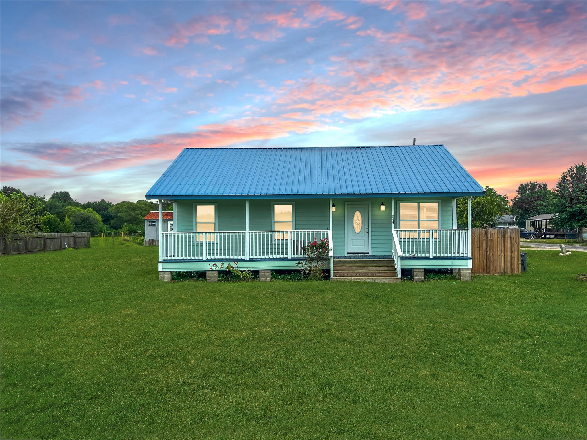 1855 Campbell Road Winnie, TX 77665 - Photo 1 of 11 a view of a house with a yard