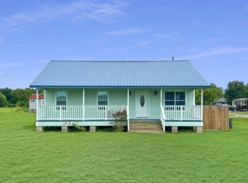 1855 Campbell Road Winnie, TX 77665 - Photo 11 of 11 a view of backyard of house with green space