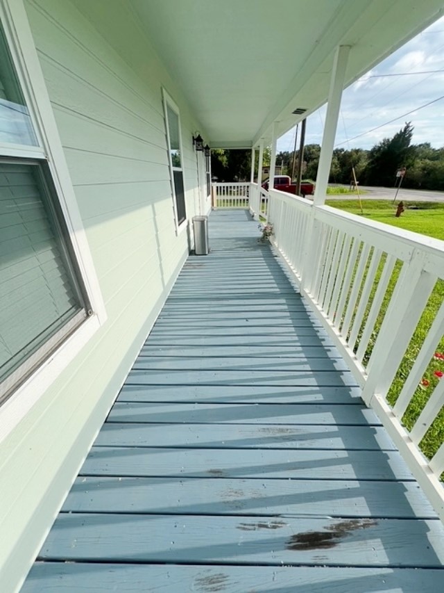 1855 Campbell Road Winnie, TX 77665 - Photo 2 of 11 a view of balcony with wooden floor