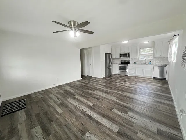 a view of a kitchen with a sink and dishwasher