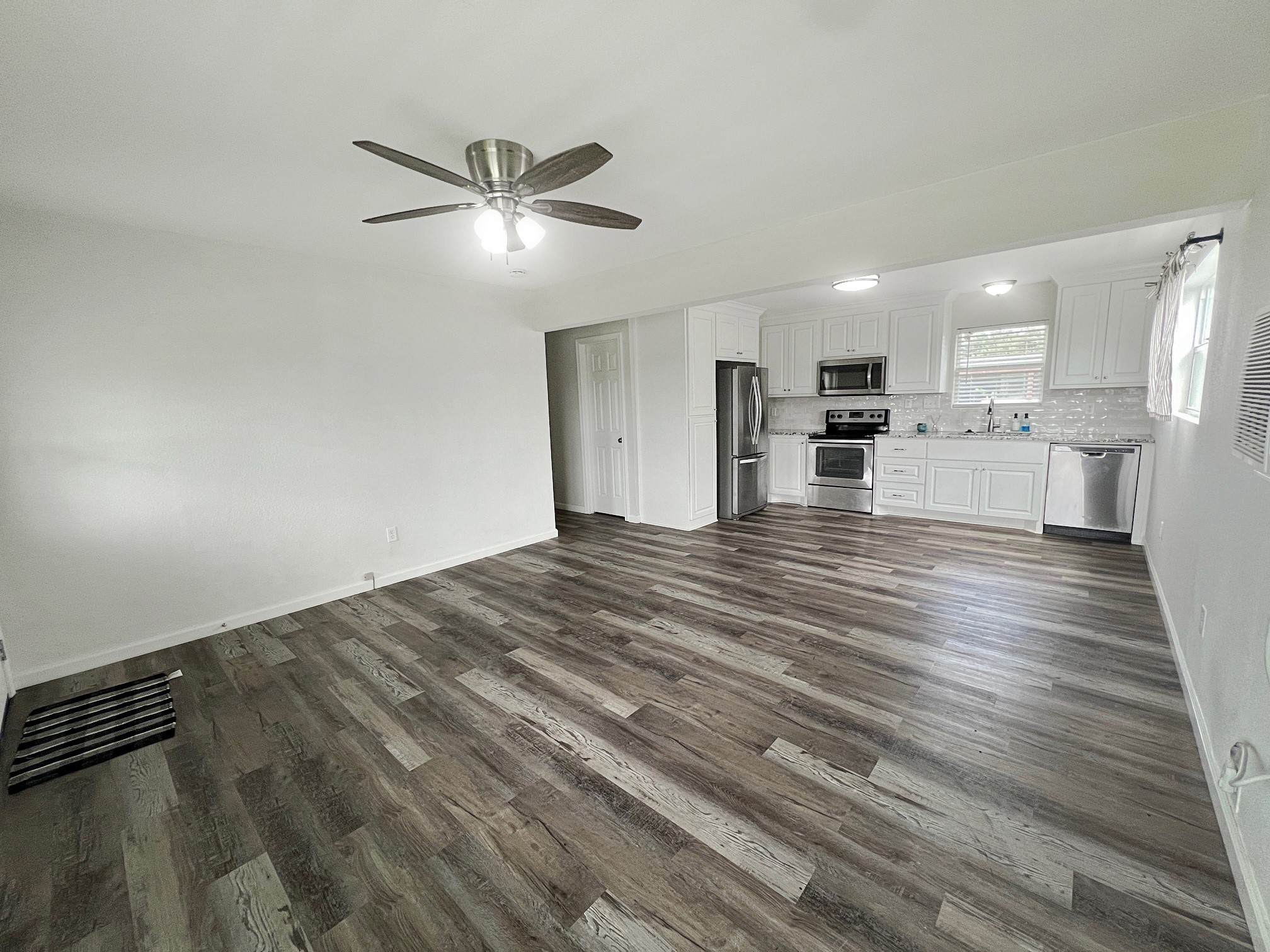 1855 Campbell Road Winnie, TX 77665 - Photo 5 of 11 a view of a kitchen with a sink and dishwasher