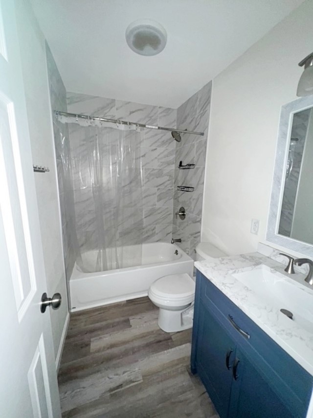 1855 Campbell Road Winnie, TX 77665 - Photo 8 of 11 a bathroom with a sink toilet a mirror and shower