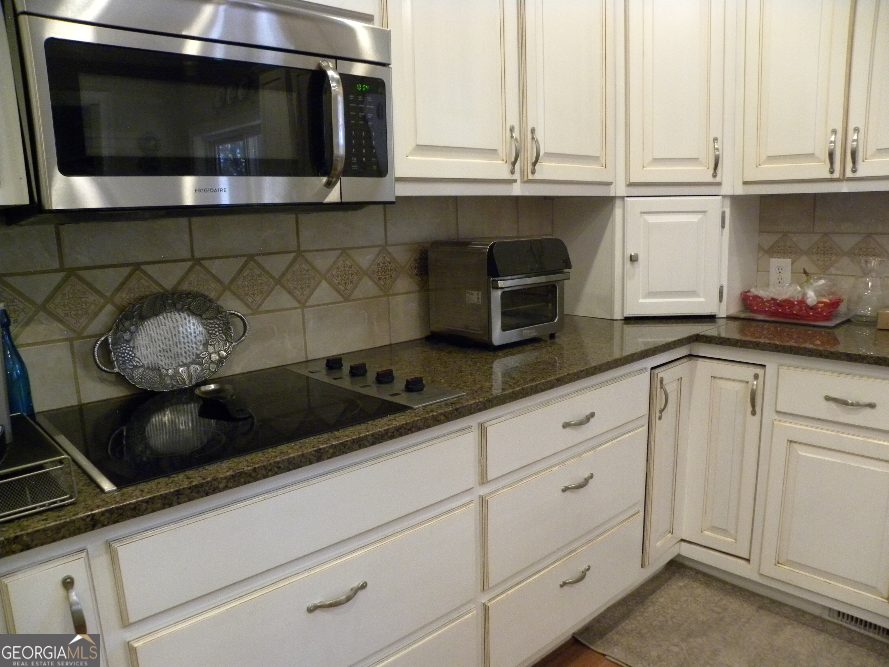 2484 Apple Pie Ridge Road, Unit 11 Alto, GA 30510 - Photo 14 of 95 a kitchen with granite countertop stainless steel appliances a stove and a microwave