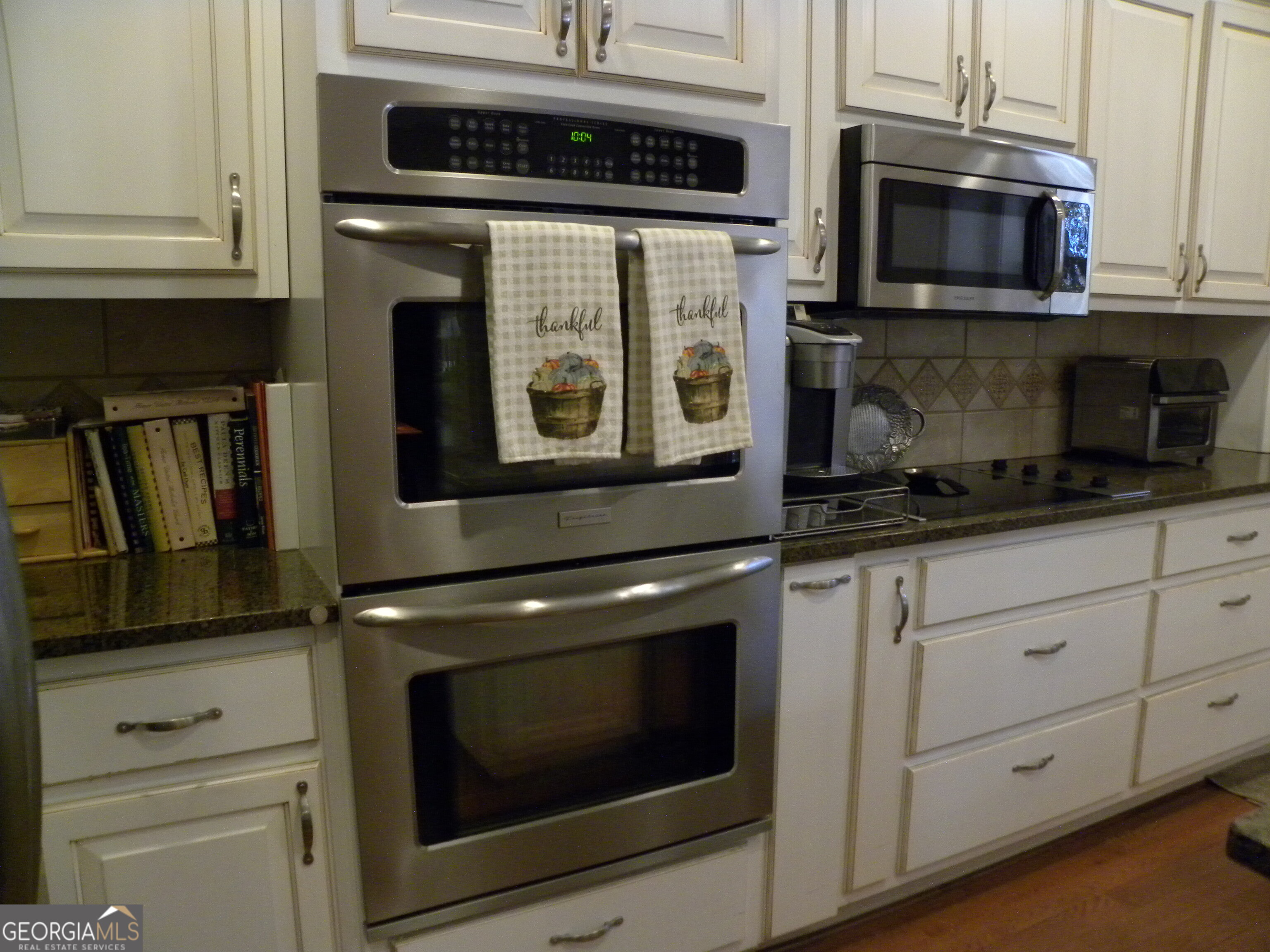2484 Apple Pie Ridge Road, Unit 11 Alto, GA 30510 - Photo 15 of 95 a kitchen with stainless steel appliances granite countertop white cabinets and black stove top oven
