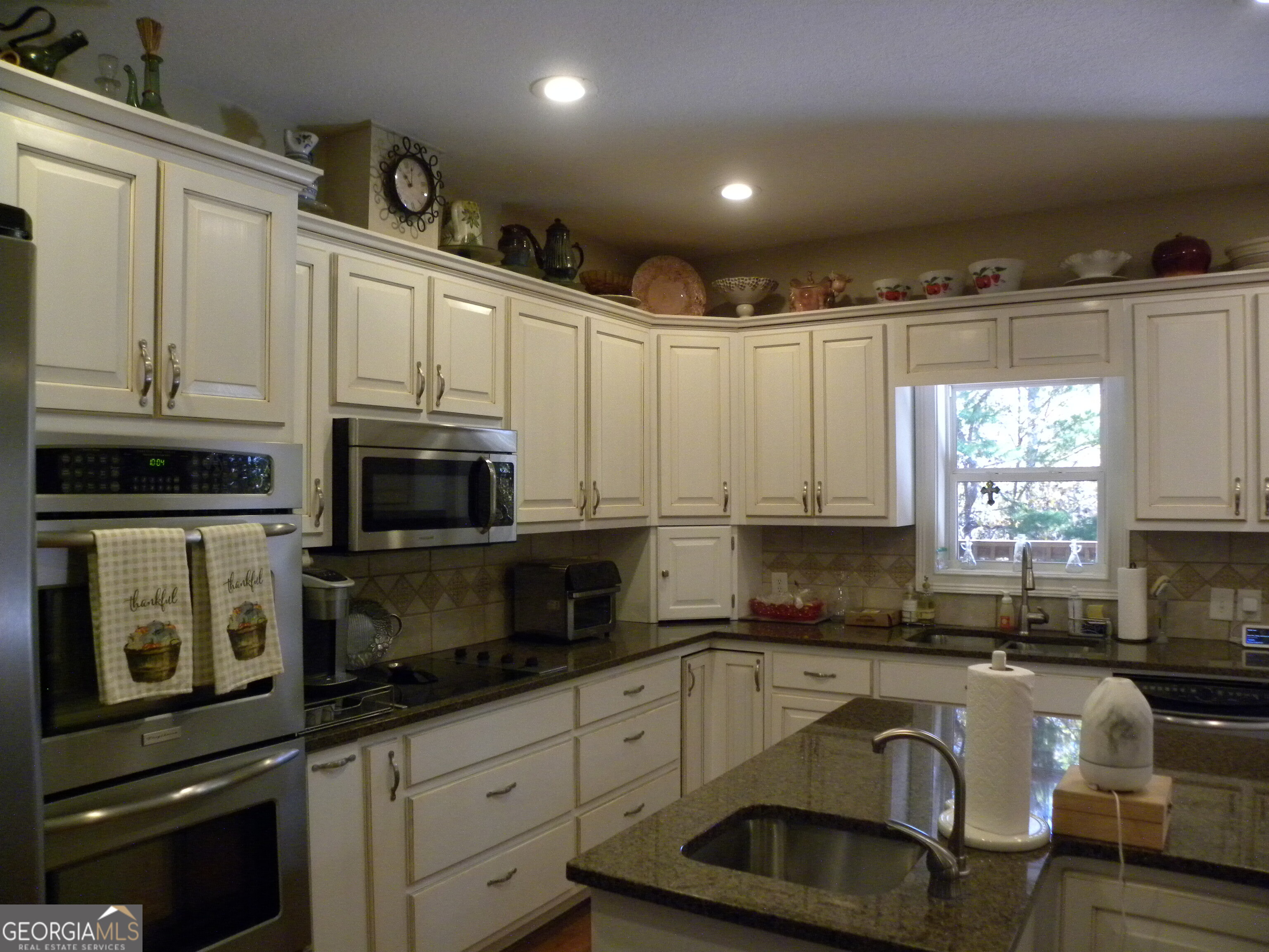 2484 Apple Pie Ridge Road, Unit 11 Alto, GA 30510 - Photo 16 of 95 a kitchen with granite countertop a sink window and cabinets
